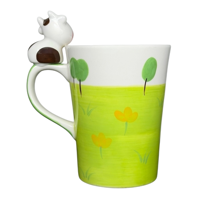 Indra vintage cow handle mug with colorful flower design and playful cow accent