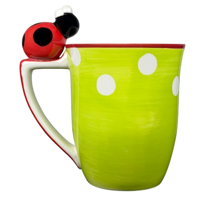 Indra vintage ladybug handle mug in bright green with white polka dots and a playful ladybug design