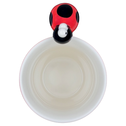 Indra vintage ladybug handle mug with a colorful handle design and smooth white interior