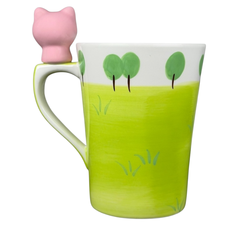 Indra vintage pig handle mug in green with a cute pink pig handle design and tree illustrations