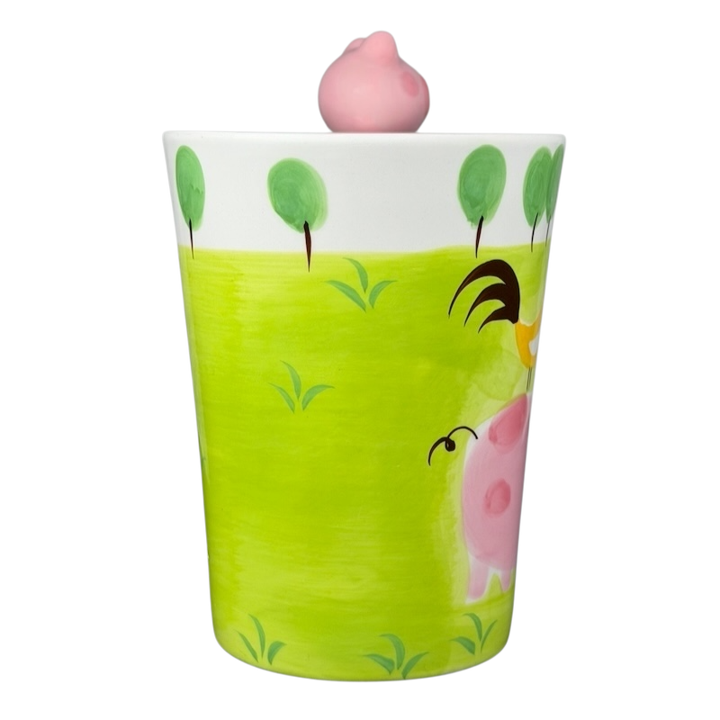 Indra vintage pig handle mug with colorful design featuring a playful pig and green landscape