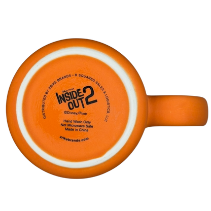 Inside Out 2 Anxiety mug in bright orange with hand wash only care instructions on the bottom