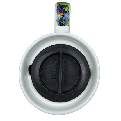 Top view of Irises Vincent Van Gogh Mug Chaleur with a black lid and colorful design