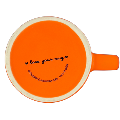 Bottom view of orange Love Your Mug brand it is what it is vintage mug showing dishwasher and microwave safe label