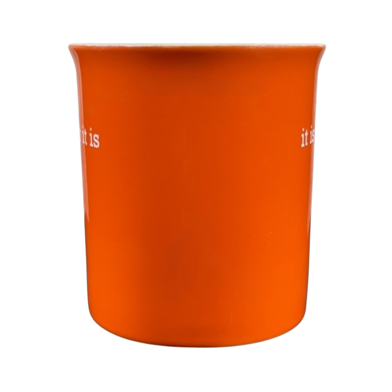 Orange ceramic it is what it is vintage mug with white text on both sides