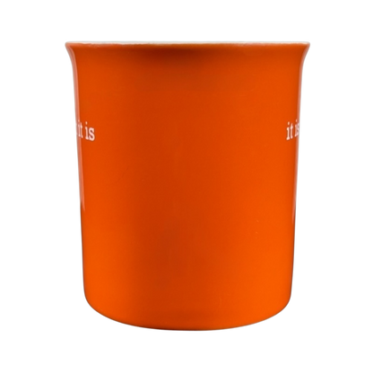 Orange ceramic it is what it is vintage mug with white text on both sides