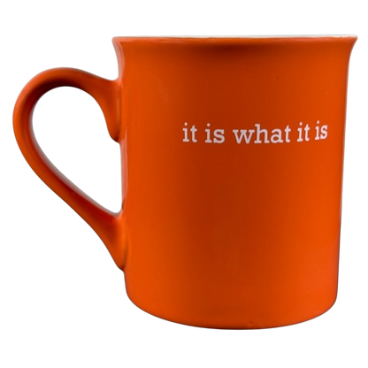 Orange ceramic it is what it is vintage mug with white text on the side and a large handle