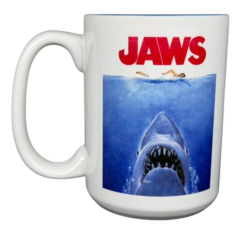 Jaws movie poster Universal Studios mug featuring a shark and swimmer illustration