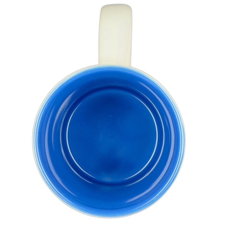 Inside view of a blue ceramic mug featuring a Jaws movie poster Universal Studios design