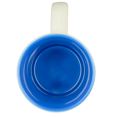 Inside view of a blue ceramic mug featuring a Jaws movie poster Universal Studios design