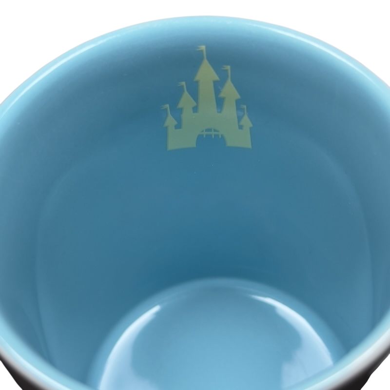 Inside view of a Jerrod Maruyama Disney mug featuring a castle design in soft colors