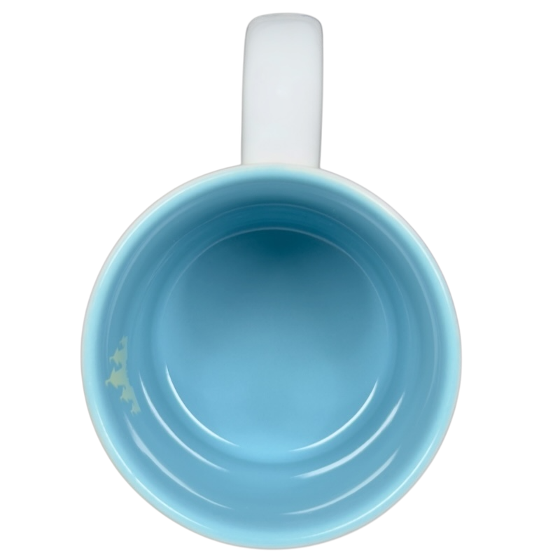 Top view of a blue interior Jerrod Maruyama Disney mug showcasing its sleek design