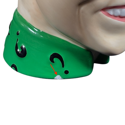 Close-up of Jim Carrey Riddler vintage 3D mug showing green collar with black question marks and small paint chip