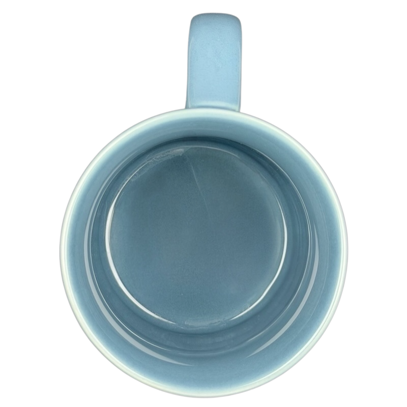 Inside view of John Wayne code creed blue collectible mug showcasing its smooth ceramic finish