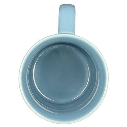 Inside view of John Wayne code creed blue collectible mug showcasing its smooth ceramic finish