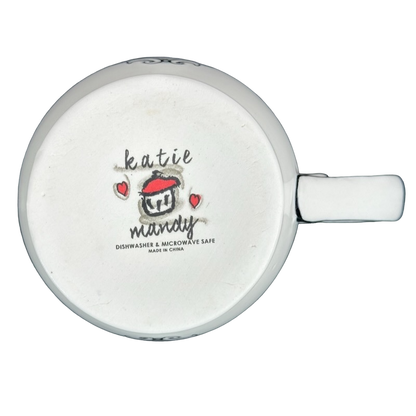 Bottom view of Katie Mandy collectible mug showing logo and dishwasher microwave safe label