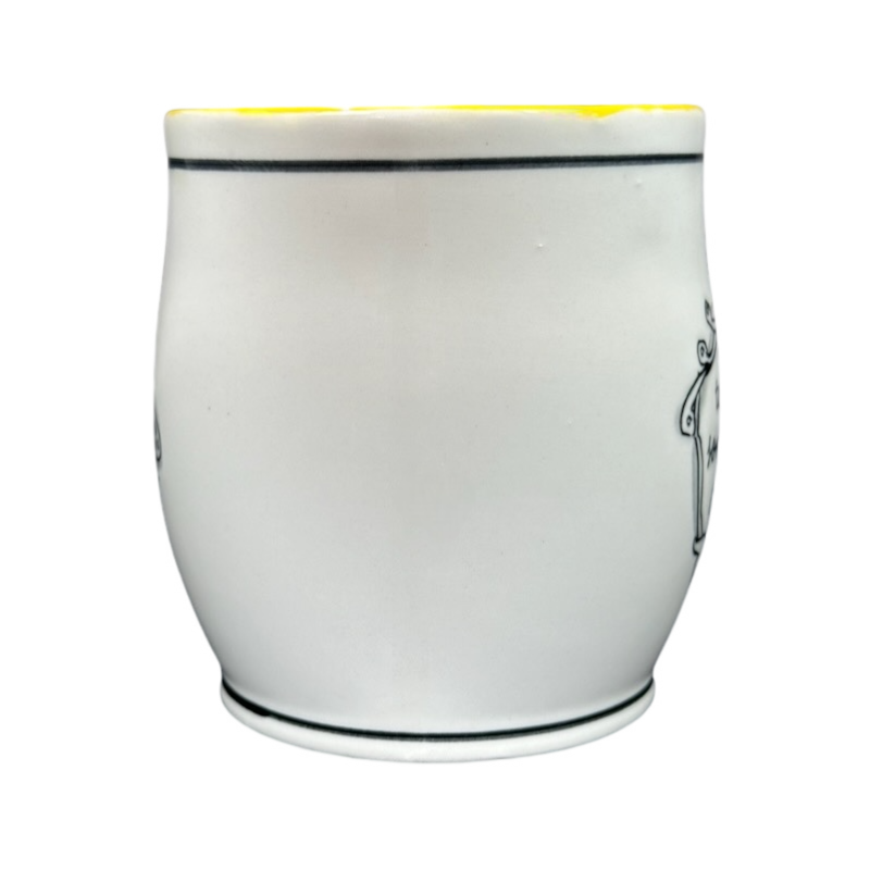 White ceramic Katie Mandy collectible mug with a smooth curved design and thin black rim lines