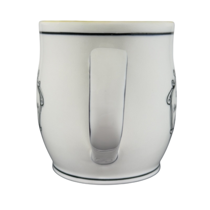 White ceramic Katie Mandy collectible mug with black decorative accents shown from the back