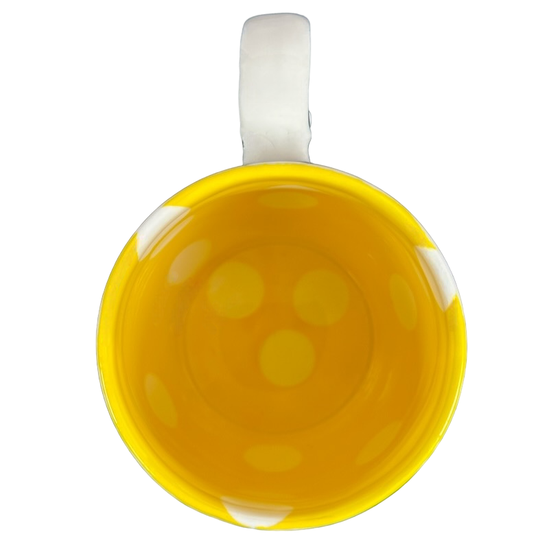 Top view of Katie Mandy collectible mug with bright yellow interior and white handle