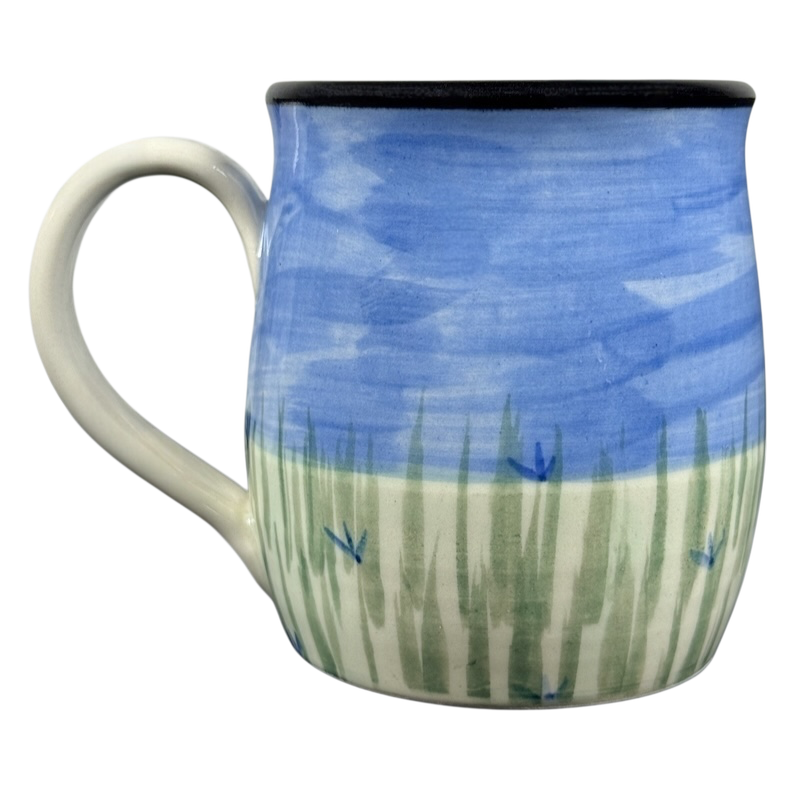 Karen Donleavy Bichon Frise mug hand painted ceramic with blue sky, green grass strokes, small blue flowers and white handle