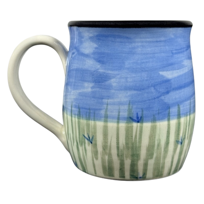 Karen Donleavy Bichon Frise mug hand painted ceramic with blue sky, green grass strokes, small blue flowers and white handle