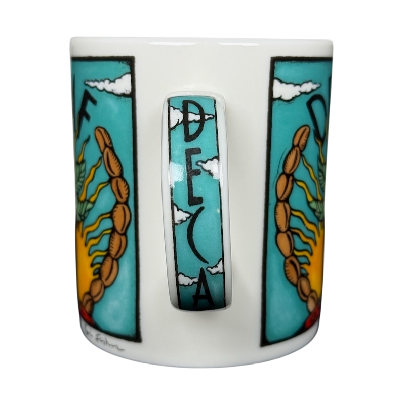 Decaf Kris Fisher Chaleur mug white ceramic with turquoise panels sun and wheat design and cloudy handle