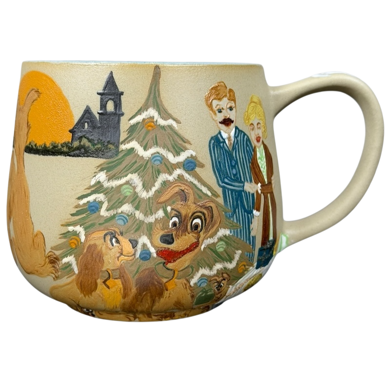 Lady and the Tramp hand-painted pottery mug featuring a festive scene with dogs and a Christmas tree