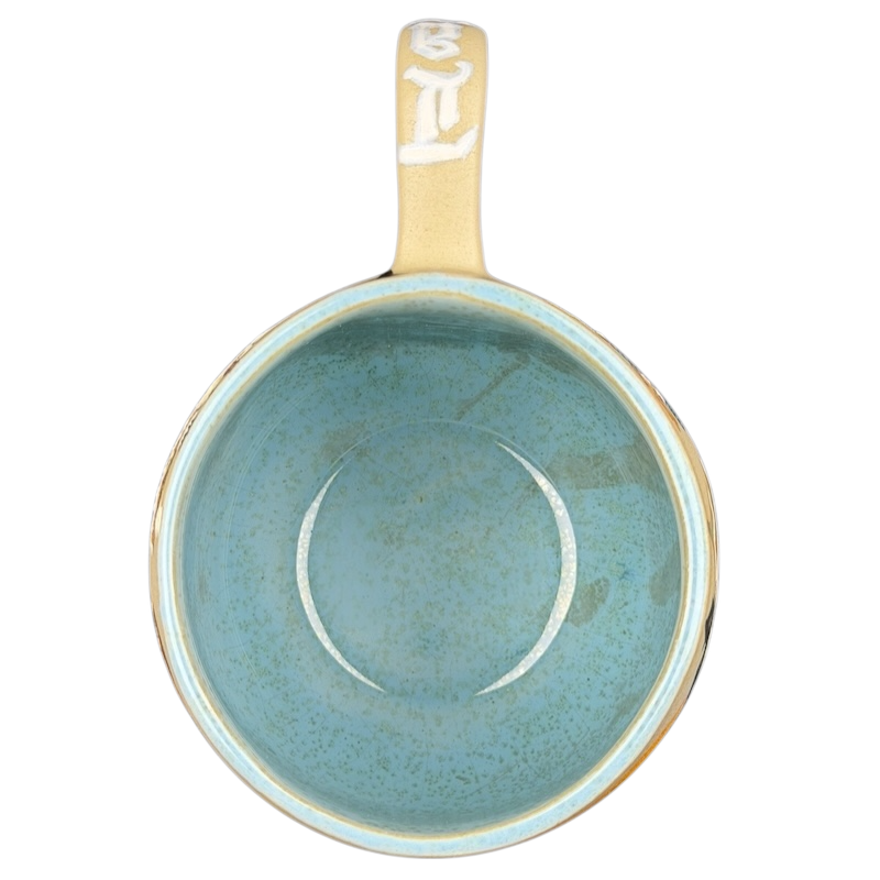 Inside view of a Lady and the Tramp hand-painted pottery mug in a soothing blue color