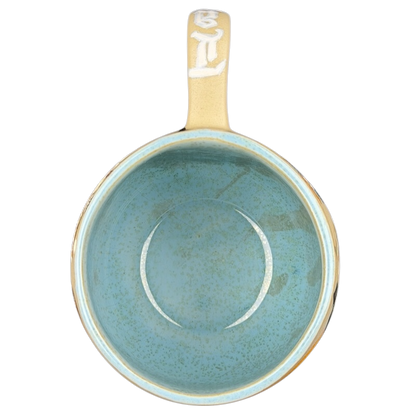 Inside view of a Lady and the Tramp hand-painted pottery mug in a soothing blue color