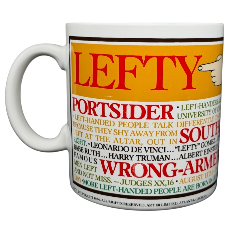 Lefty Kenneth Grooms Mug The Toscany Collection featuring colorful graphics and text about left-handedness