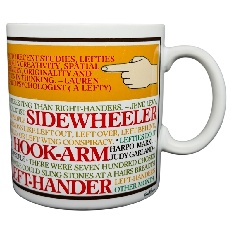 Lefty Kenneth Grooms Mug The Toscany Collection featuring colorful text about left-handedness and creativity