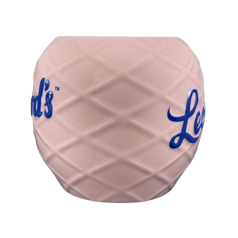 Leonard's Bakery collectible mug in pink with blue lettering featuring a textured design