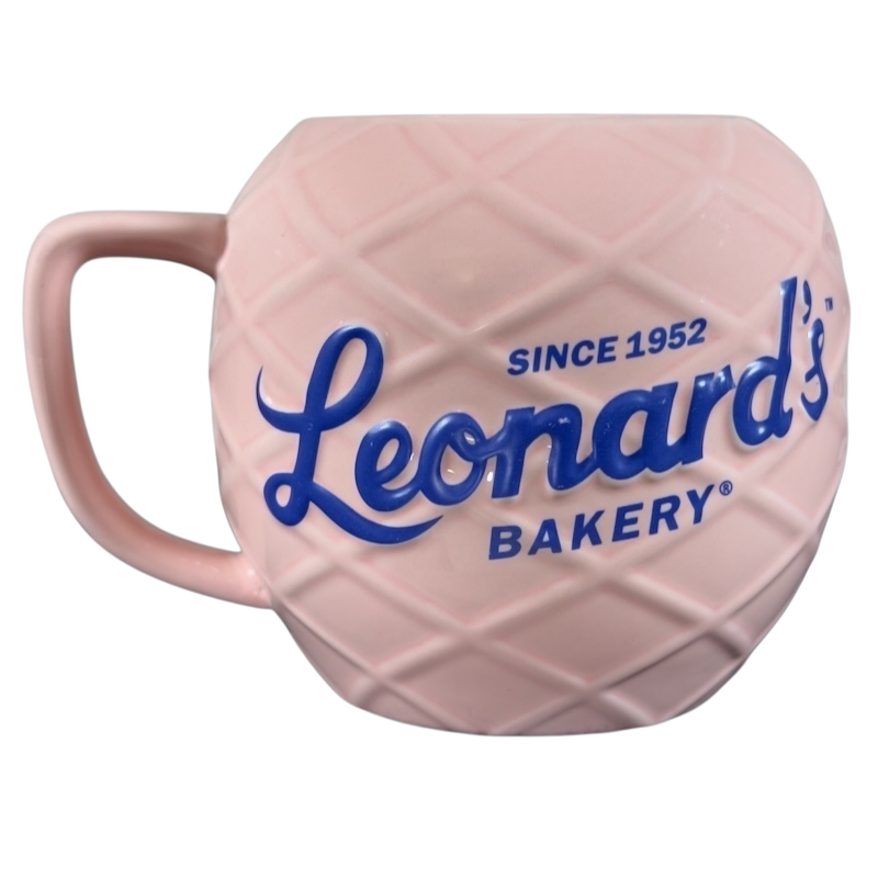 Leonard's Bakery collectible mug in pink with textured design and blue logo since 1952