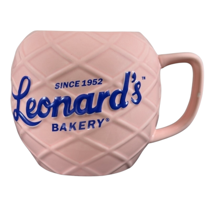 Leonard's Bakery collectible mug in pink with a textured design and blue lettering since 1952
