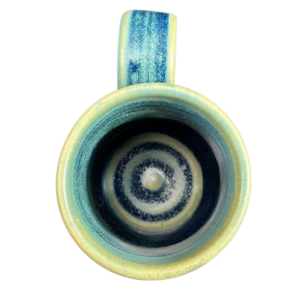 Green blue signed Lindsoe Clayworks mug showcasing a spiral design from above