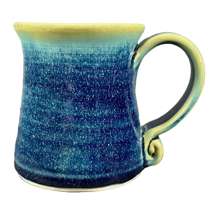 Handcrafted green blue signed Lindsoe Clayworks mug with a unique glaze finish