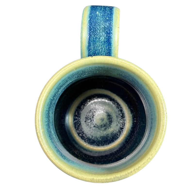Green blue signed Lindsoe Clayworks mug with unique interior glaze design and a comfortable handle