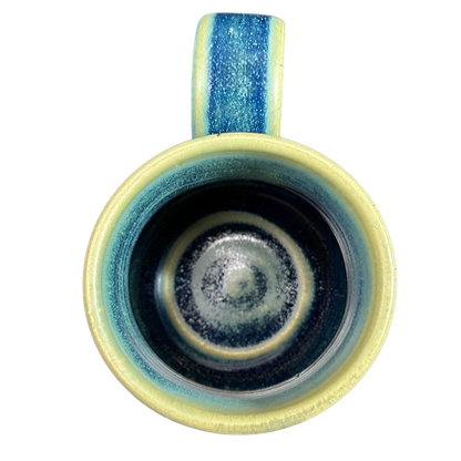 Green blue signed Lindsoe Clayworks mug with unique interior glaze design and a comfortable handle
