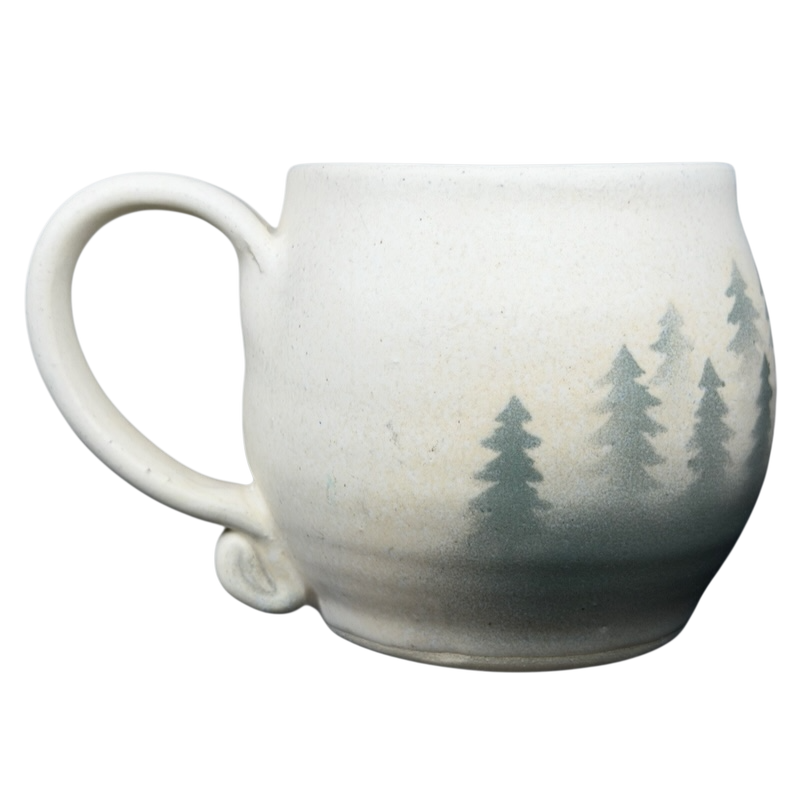Lindsoe Clayworks trees collectible mug featuring a natural design with evergreen tree silhouettes