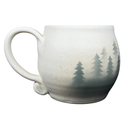 Lindsoe Clayworks trees collectible mug featuring a natural design with evergreen tree silhouettes
