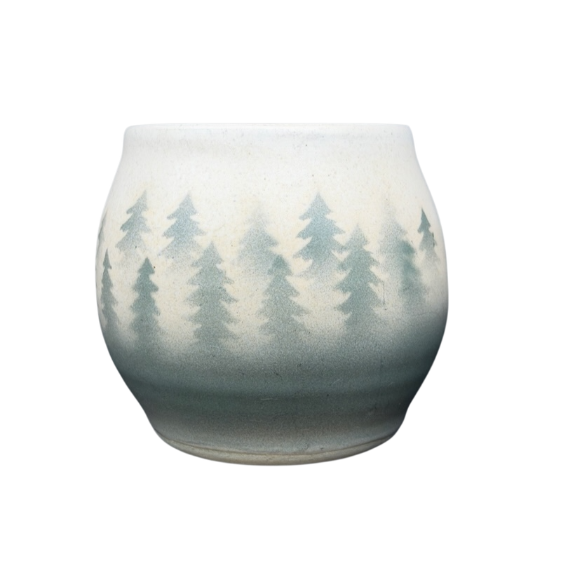 Lindsoe Clayworks trees collectible mug featuring a serene forest design in soft colors