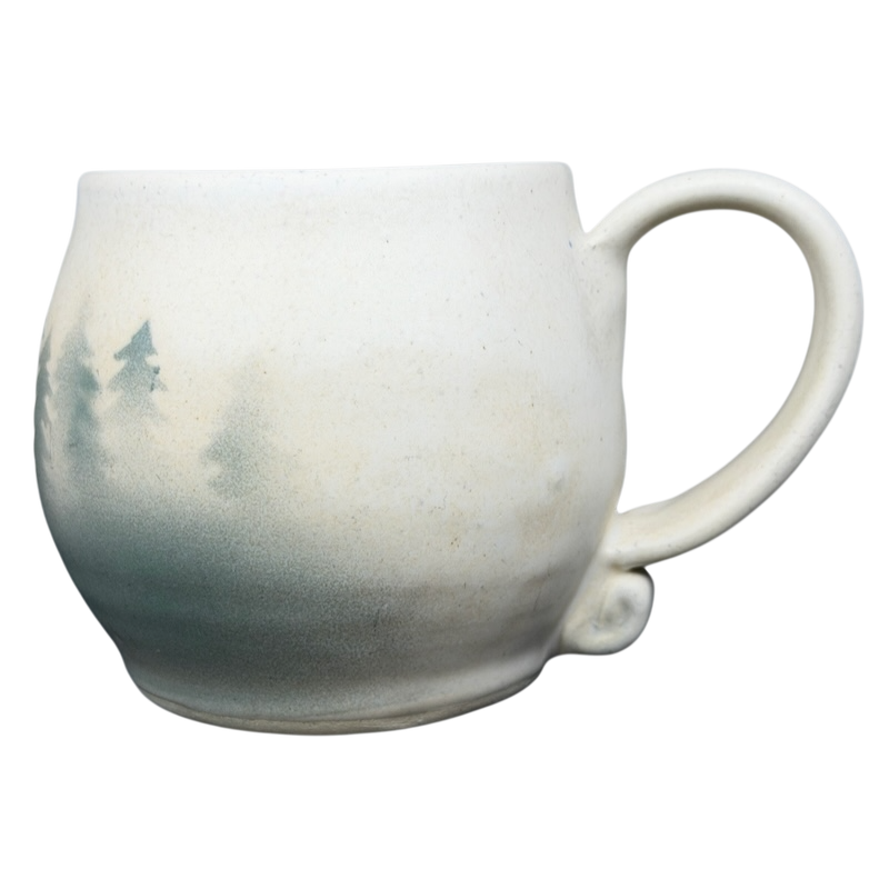 Lindsoe Clayworks trees collectible mug featuring a beautiful forest silhouette design
