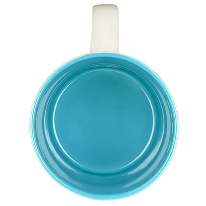 Top view of the LORI Poetry Name Mug Papel in vibrant turquoise interior and white outer surface