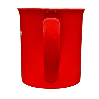 Red ceramic coffee mug with handle facing forward on black background hot mess Love Your Mug
