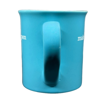 Ceramic coffee mug front view with handle on black background make it happen blue Love Your Mug motivational