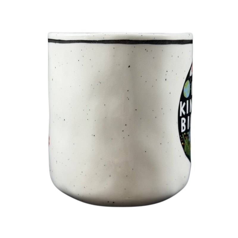 Luke John Matthew Arnold Anthropologie Kindness mug with a speckled white design and vibrant colors