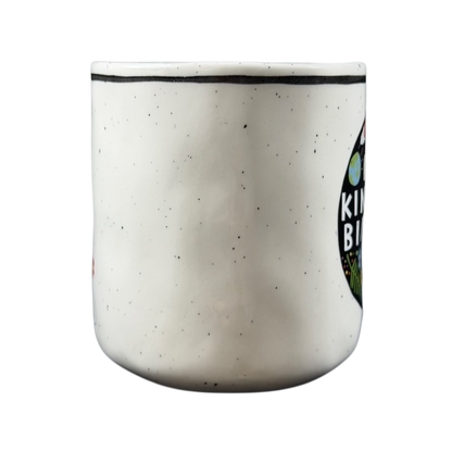 Luke John Matthew Arnold Anthropologie Kindness mug with a speckled white design and vibrant colors