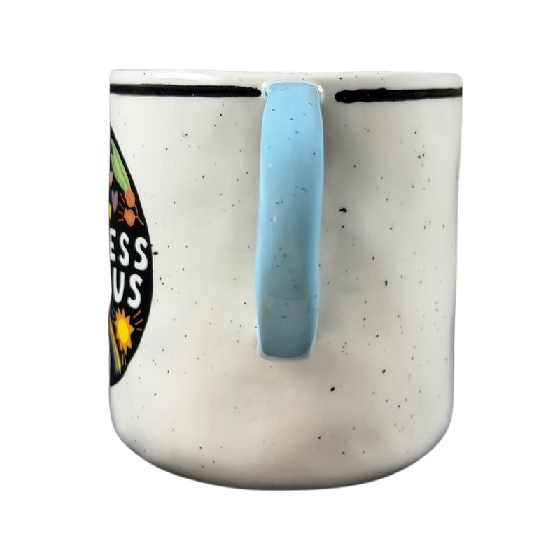 Luke John Matthew Arnold Anthropologie Kindness mug with blue handle and colorful design