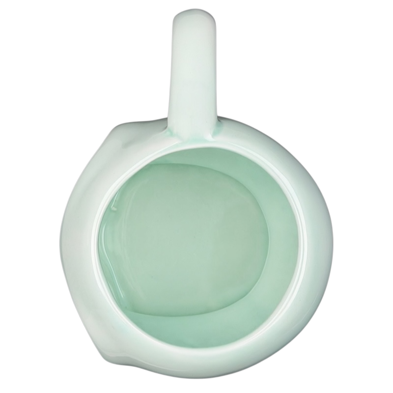 Lyon Motion Products vintage alien mug with a smooth mint green interior and classic design