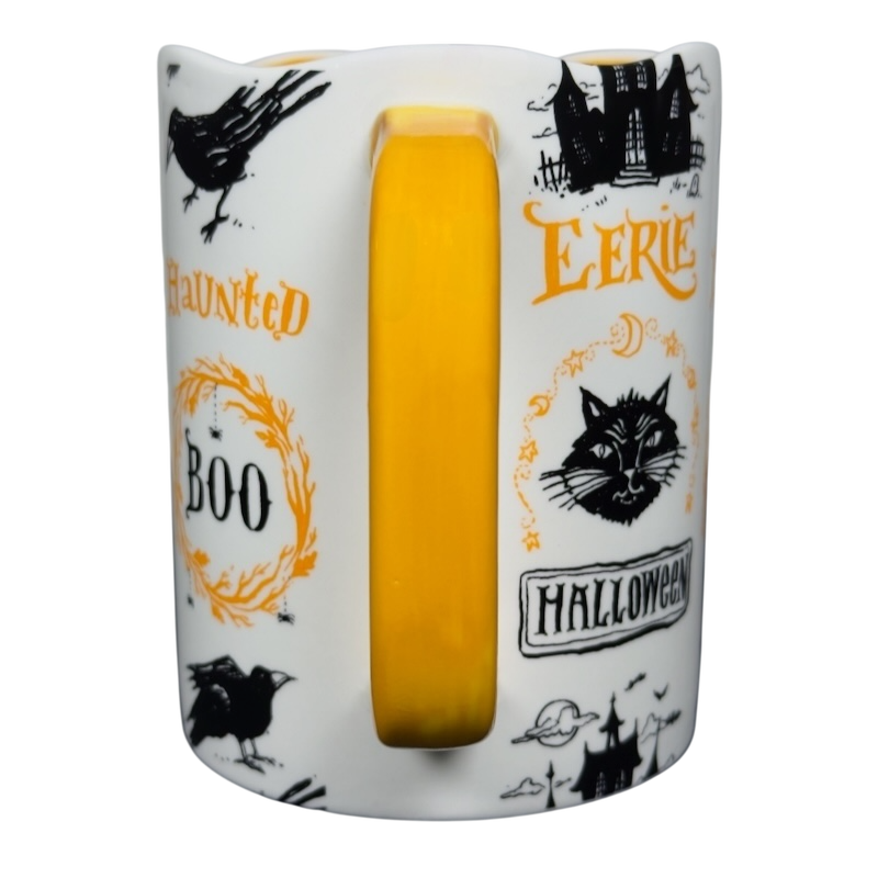 Magenta Angela Staehling Halloween collectible mug white ceramic with yellow handle and black orange spooky illustrations